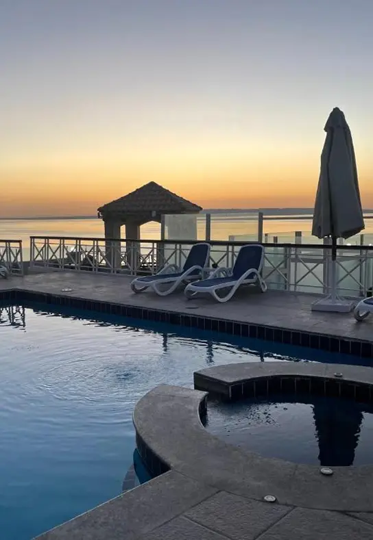 Seaside pool view at sunrise